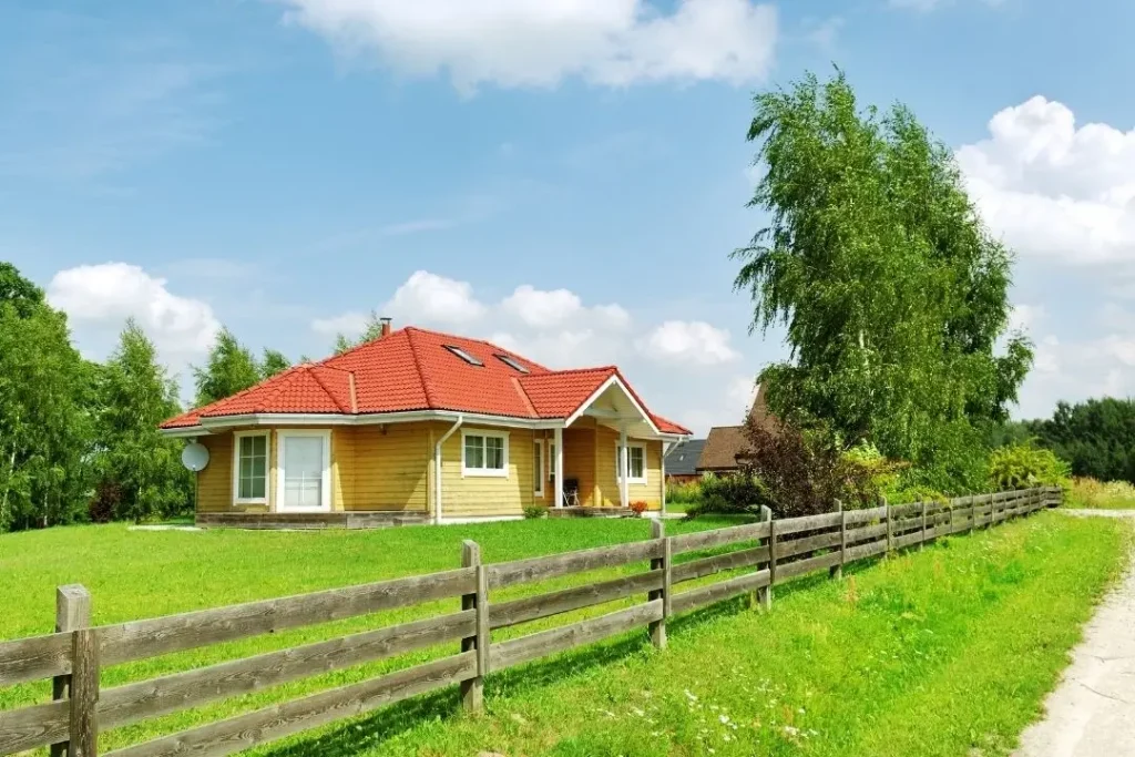 House with post and rail fence